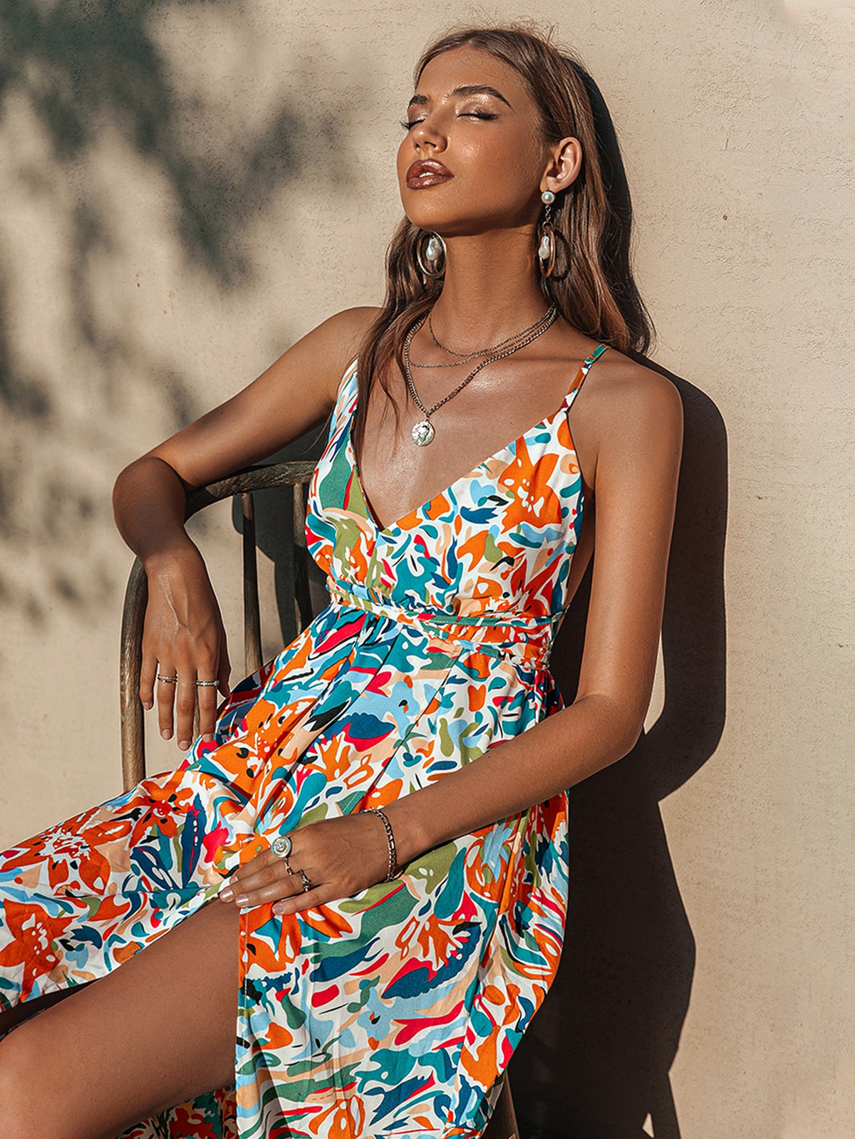 Backless summer party dress with holiday print, high waist, V-neck, lace-up detail, and split maxi length by The Clothing Company Sydney