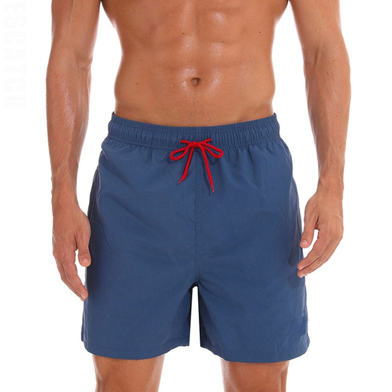 Men's swim shorts by The Clothing Company Sydney, stylish beach board shorts for surfing, swimming, and running in vibrant colors.