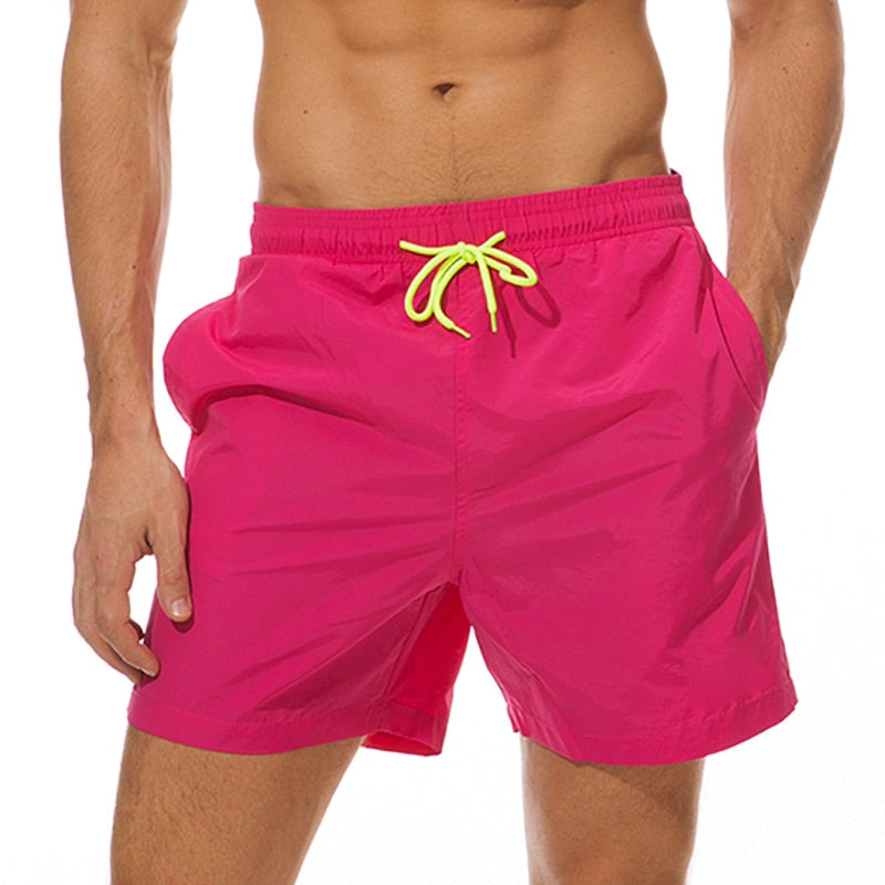 Men's swim shorts by The Clothing Company Sydney featuring a vibrant beach board short design for swimming and beach activities.