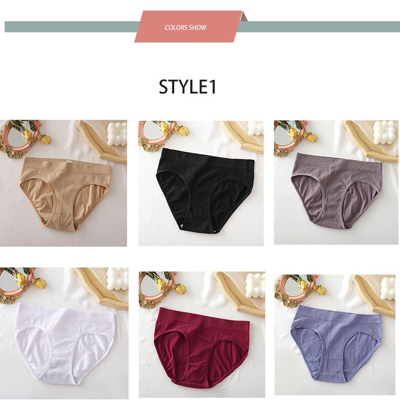 Two-pack seamless women's thong panties by The Clothing Company Sydney, comfortable cotton blend bikini G-string underwear on a model.