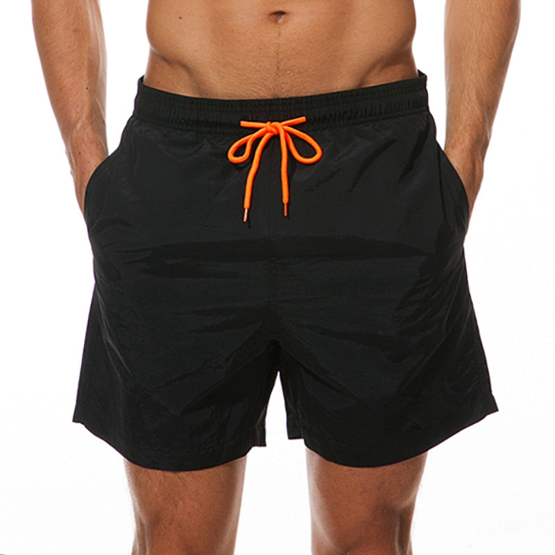 Men's swim shorts by The Clothing Company Sydney, lightweight beach board shorts with quick-dry fabric and sporty design.