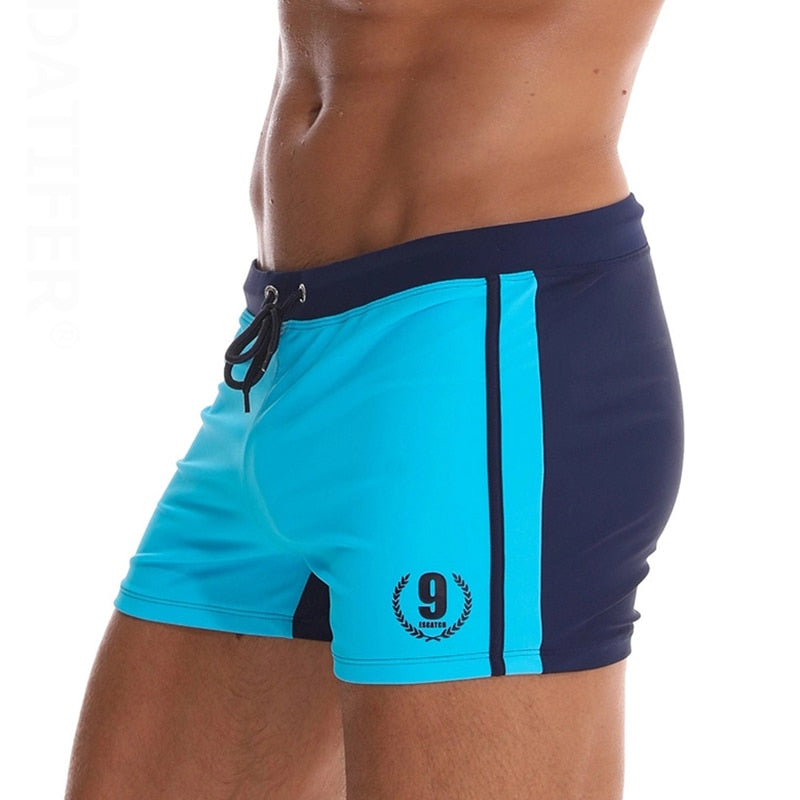 Men's breathable swim trunks from The Clothing Company Sydney, featuring stylish beach shorts and boxer briefs for swimming and beach wear.