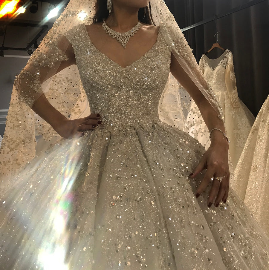 Luxury wedding dress by The Clothing Company Sydney featuring heavy beading and elegant bridal gown design.
