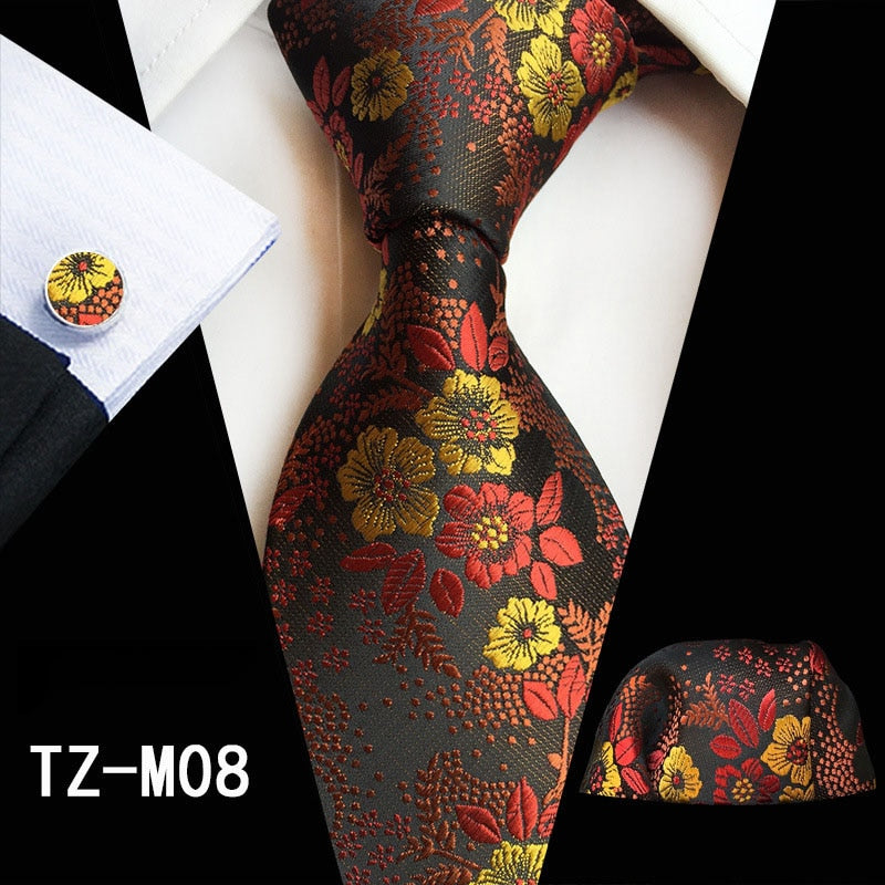 Men's silk tie set with red and green floral patterns, includes cufflinks, handkerchief, and matching accessories from The Clothing Company Sydney