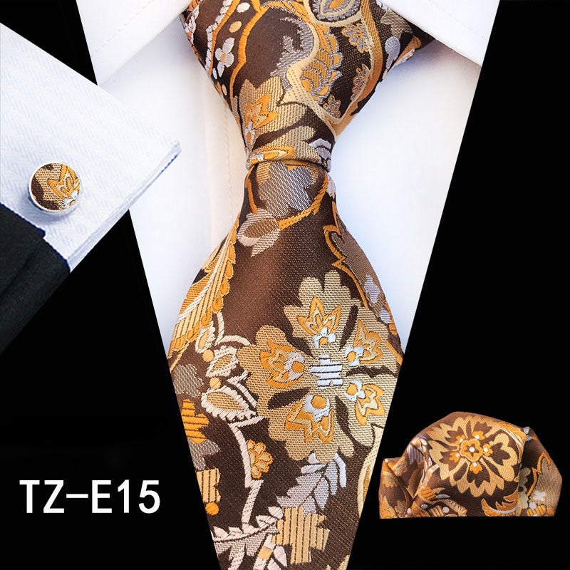 Red and green floral silk men's tie set with cufflinks, handkerchief, and accessories from The Clothing Company Sydney.
