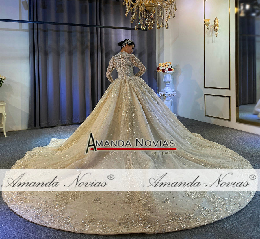 Luxury full pearls wedding dress with long train by The Clothing Company Sydney, featuring intricate pearl details and elegant design.