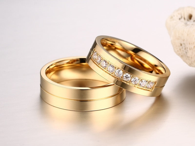 Gold-colored stainless steel wedding band bracelet for couples, featuring CZ accents, from The Clothing Company Sydney.
