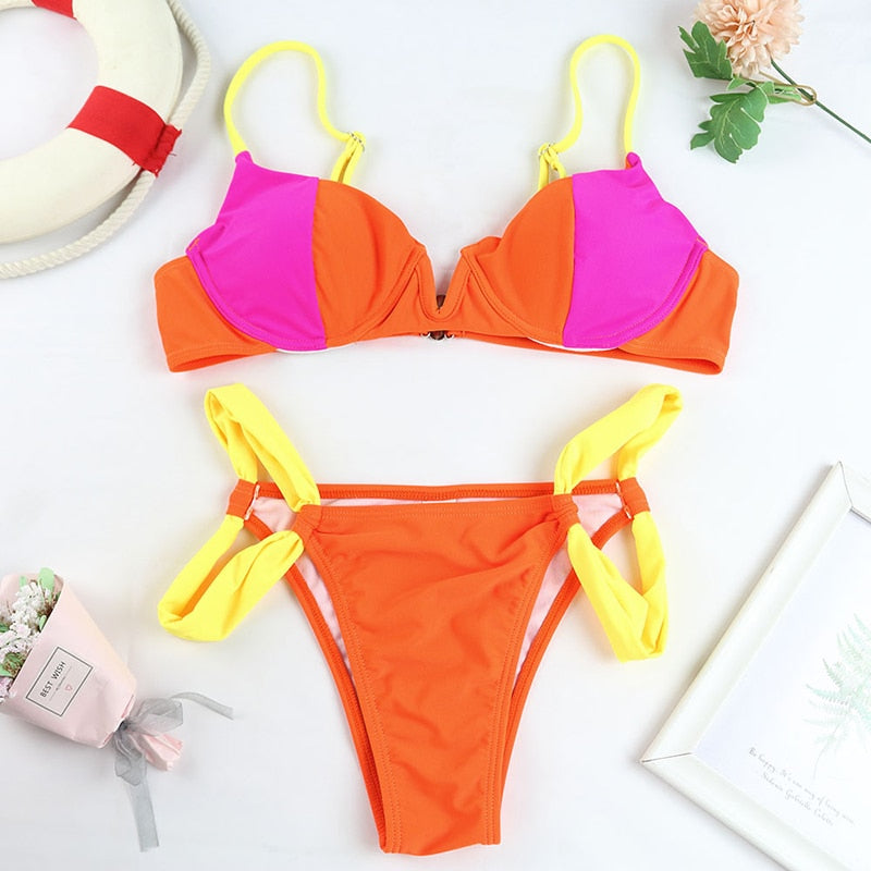 Two-piece patchwork push-up swimsuit bikini set by The Clothing Company Sydney, featuring colorful design and supportive swimwear fit.