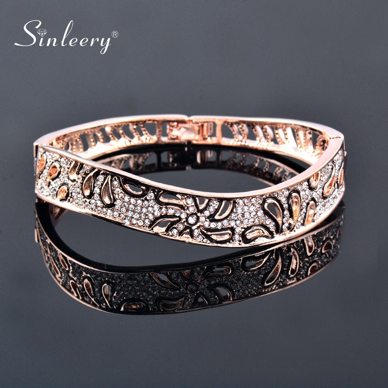 Elegant rose gold and silver flower bangles with crystal accents, perfect as jewelry gifts for women.