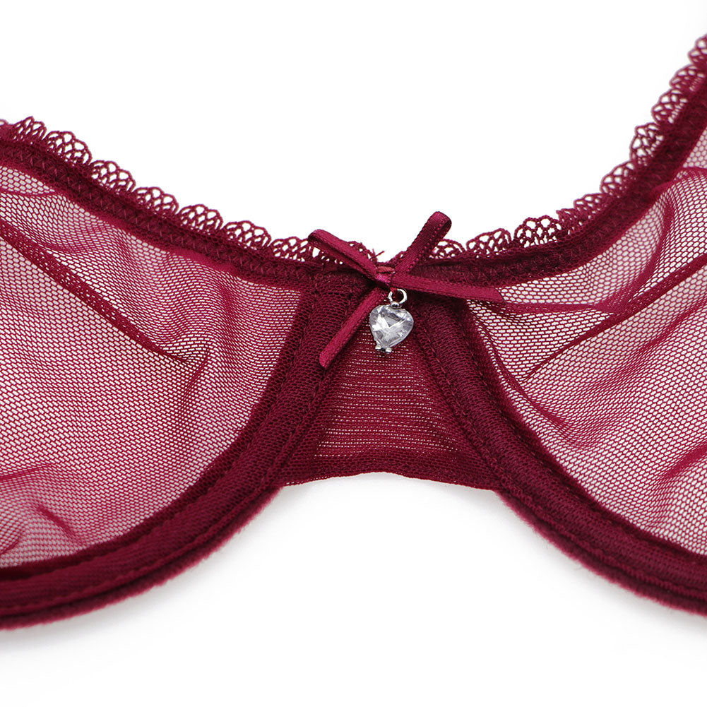 Ultra-thin transparent yarn lingerie set with bras, garters, thongs, and stockings from The Clothing Company Sydney displayed on a model.