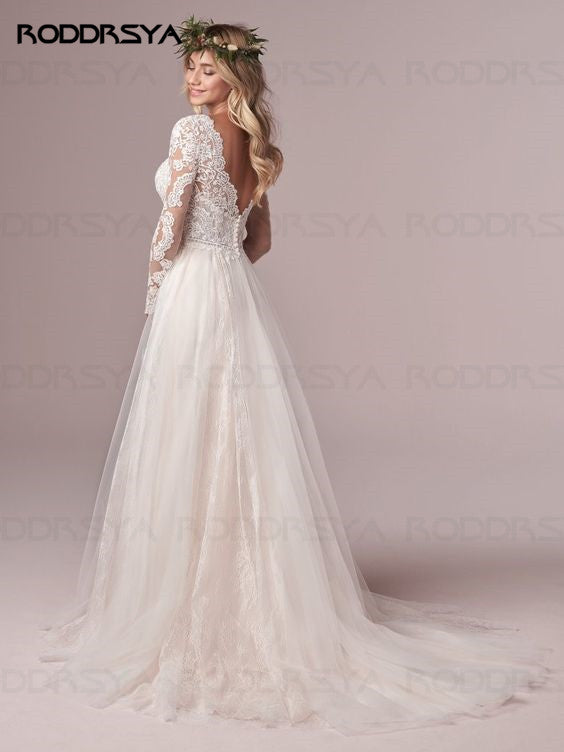 Ivory A-line long sleeve wedding dress with lace details, tulle fabric, open back design, by The Clothing Company Sydney