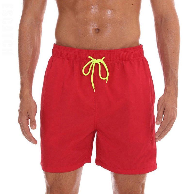Men's swim shorts by The Clothing Company Sydney, featuring sporty beach board shorts and surfing-style swim trunks.
