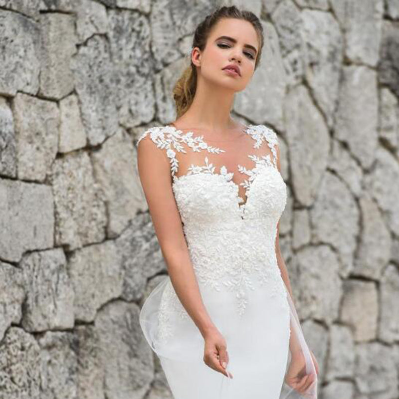 See-through back mermaid wedding dress with sleeveless lace appliques, elegant bridal gown by The Clothing Company Sydney.