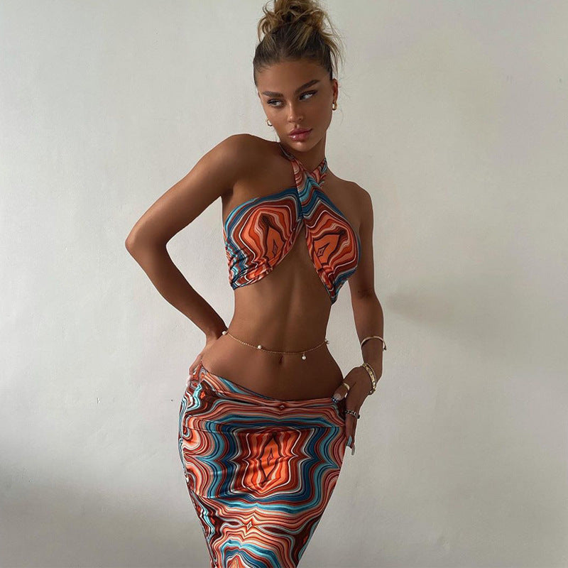 Two-piece summer dress set featuring a printed halter crop top and matching skirt from The Clothing Company Sydney, perfect for parties.