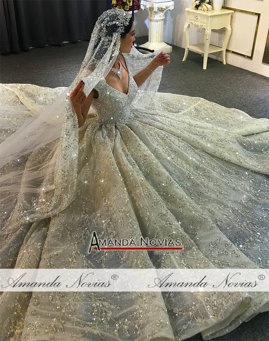 Luxury wedding dress by The Clothing Company Sydney featuring heavy beading and elegant bridal gown design.