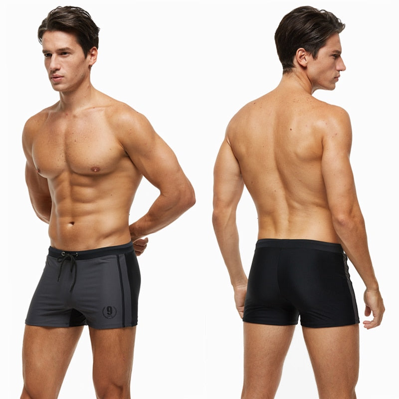 Men's breathable swim trunks from The Clothing Company Sydney featuring quick-dry fabric and beach-ready design.