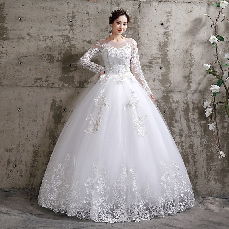 Long sleeve luxury lace wedding dress by The Clothing Company Sydney, plus size ball gown with intricate lace details.