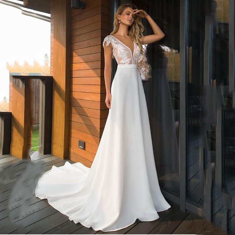 Elegant satin V-neck A-line wedding dress by The Clothing Company Sydney, backless boho bridal gown in plus size.