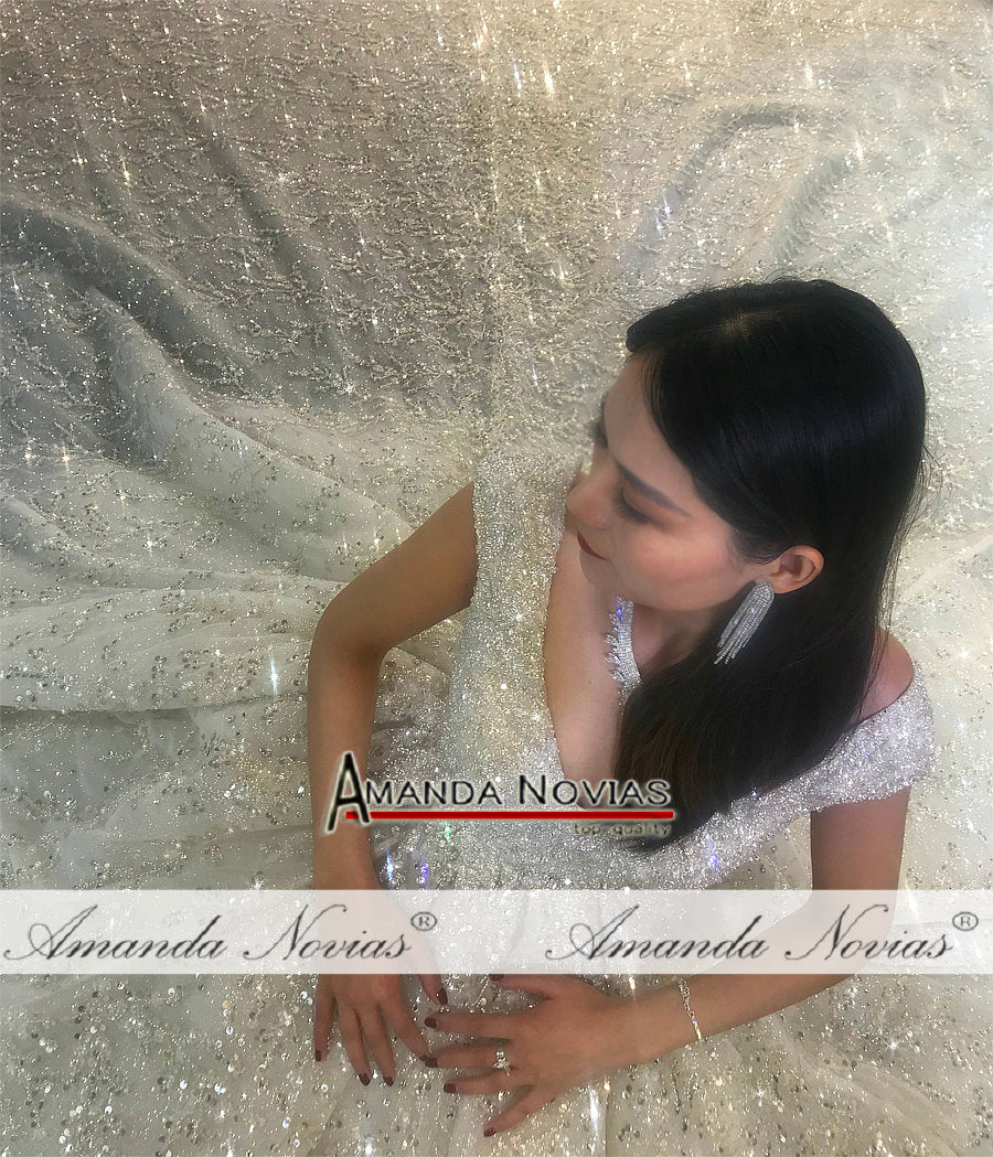 Luxury wedding dress with heavy beading by The Clothing Company Sydney, featuring intricate beadwork and elegant bridal design.