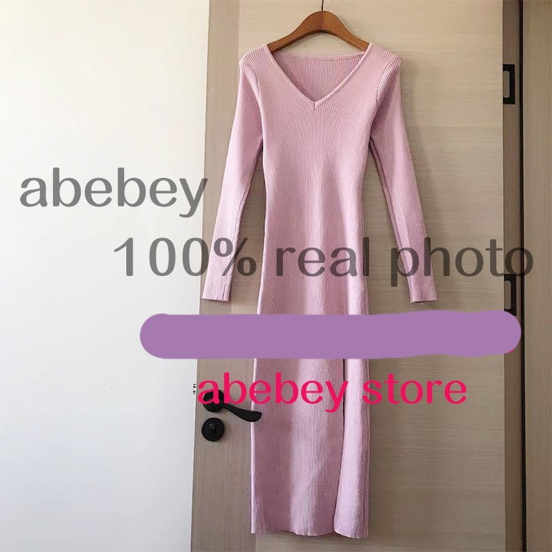 Slim fitting long sleeve slit sweater dress by The Clothing Company Sydney, over-the-knee knit dress with a stylish slit design.