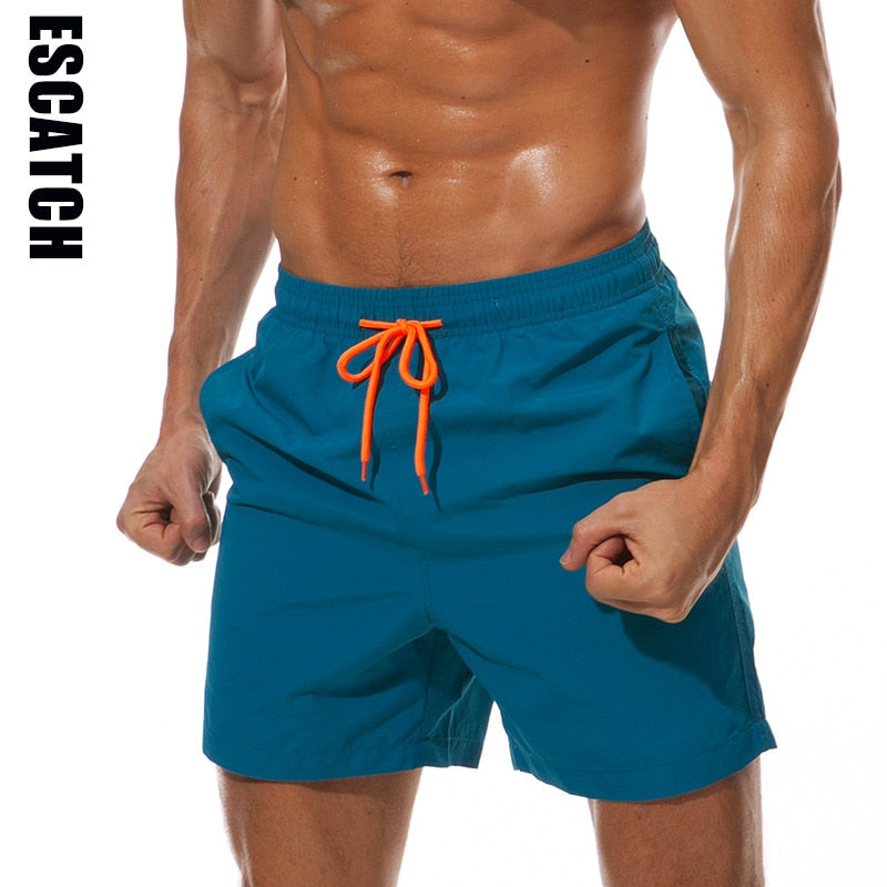 Men's swim shorts by The Clothing Company Sydney, blue beach board shorts with lightweight quick-dry fabric and adjustable waistband.