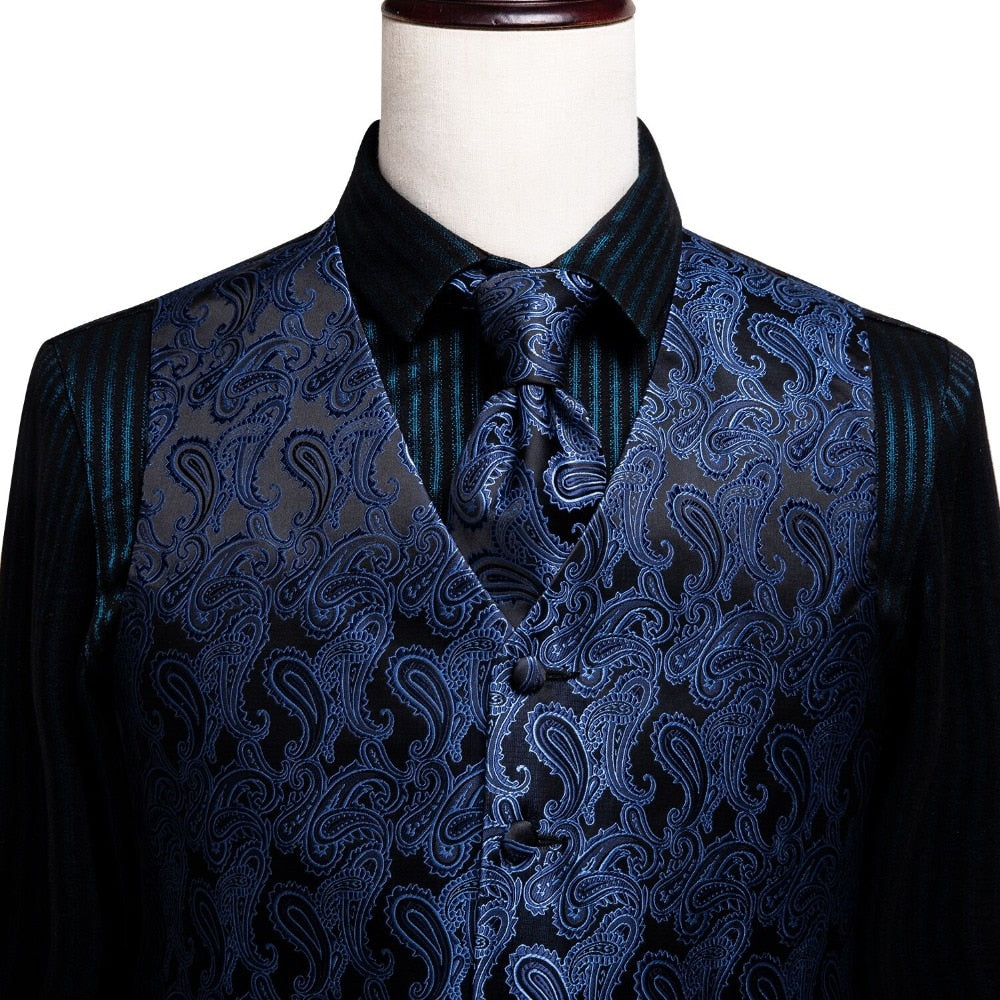 Men's luxury silk vest and tie set by The Clothing Company Sydney featuring paisley, floral, plaid designs in blue, gold, red, and silver.