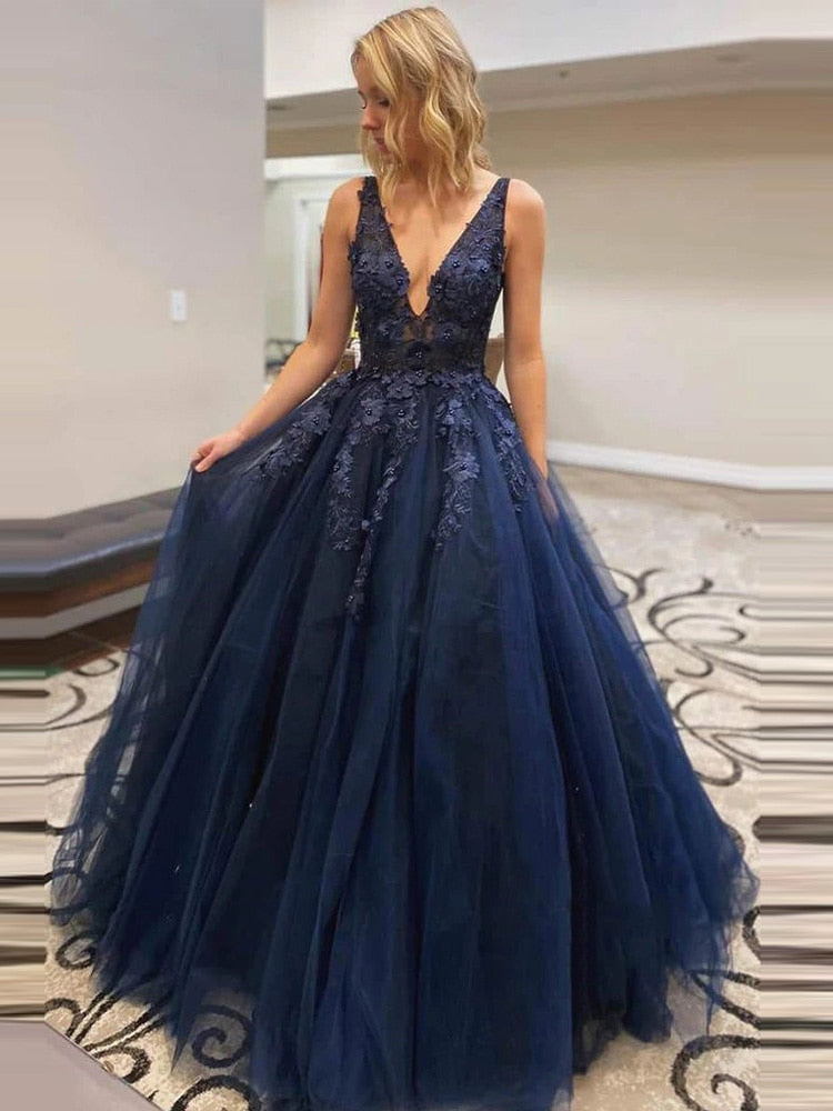 Sleeveless navy blue long prom dress with lace bodice, A-line silhouette, suitable for evening, cocktail, or formal occasions.
