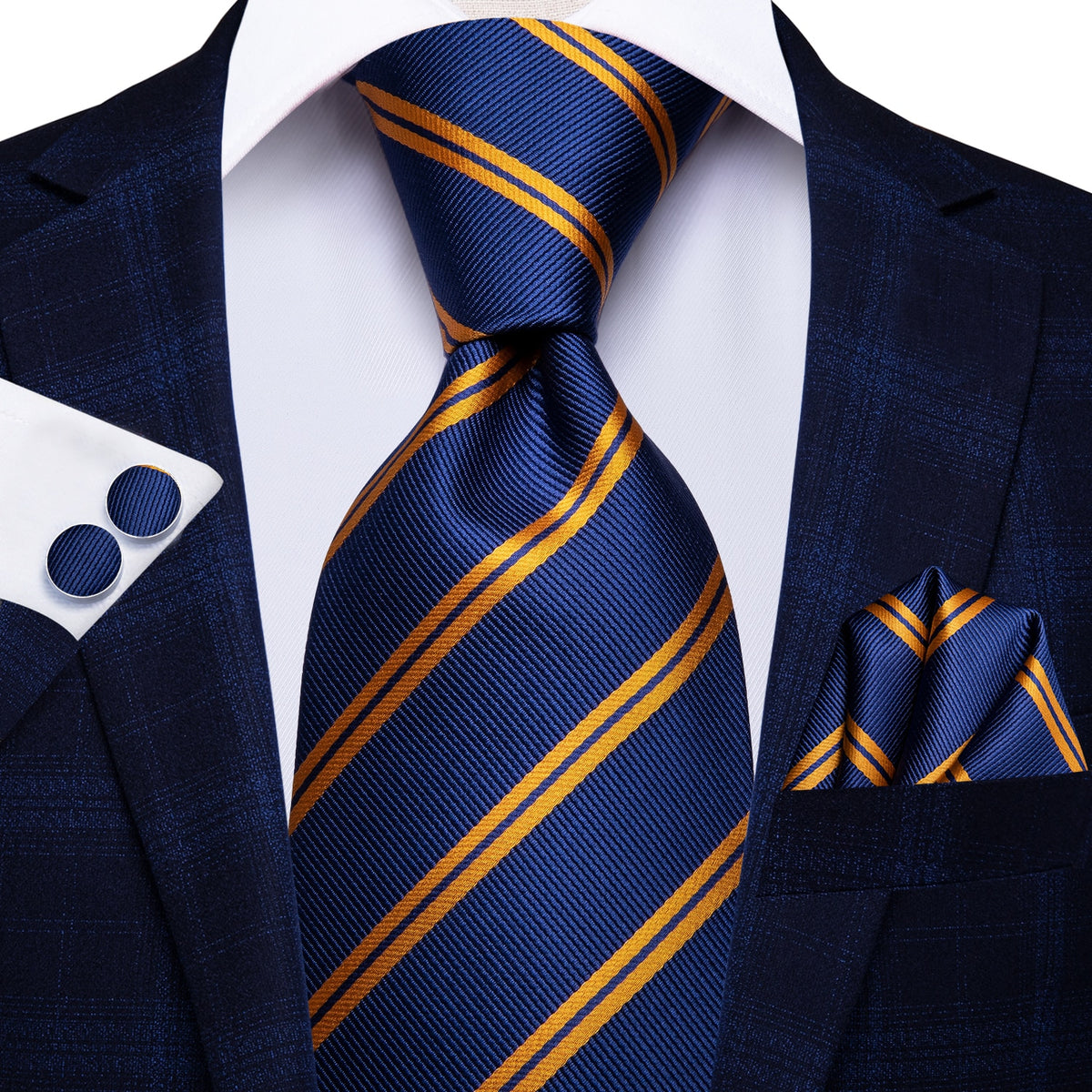 Three men's accessories including a solid paisley silk tie, pocket square, and cufflinks with a formal luxury design.