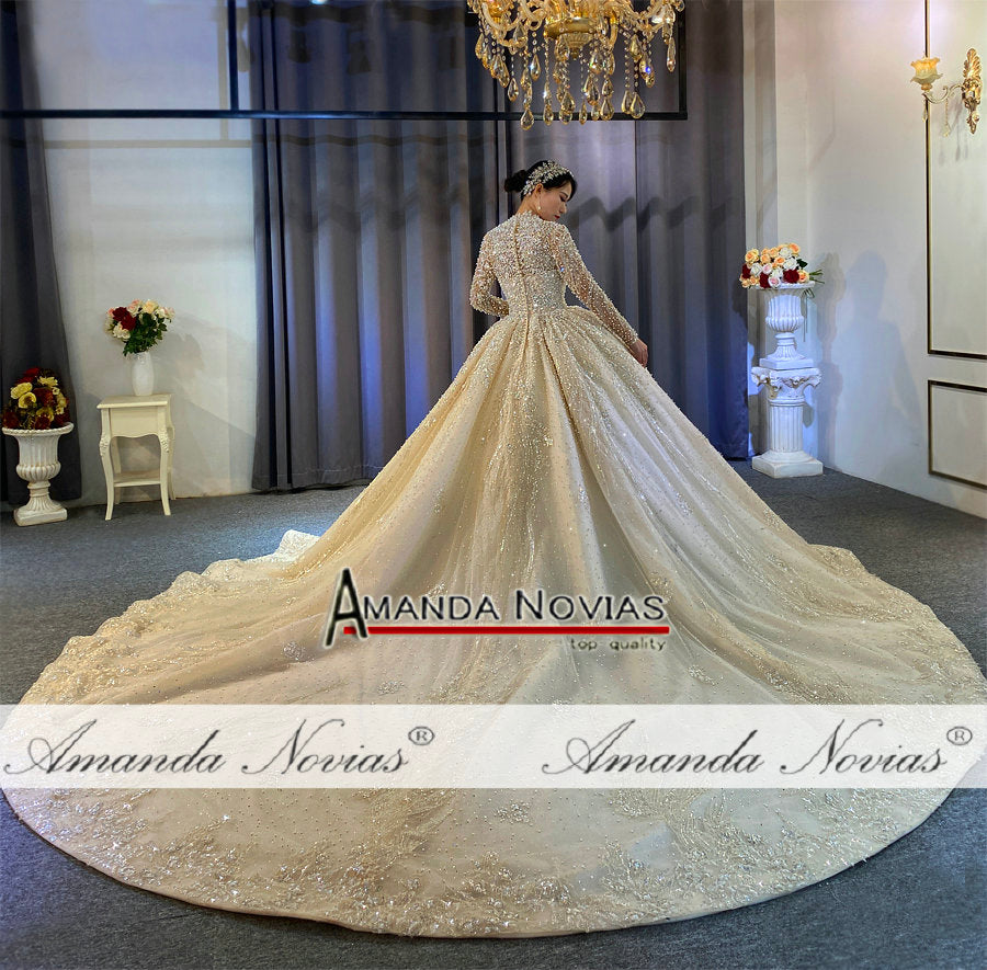 Luxury full pearls wedding dress with long train by The Clothing Company Sydney, featuring intricate pearl embellishments and elegant design.