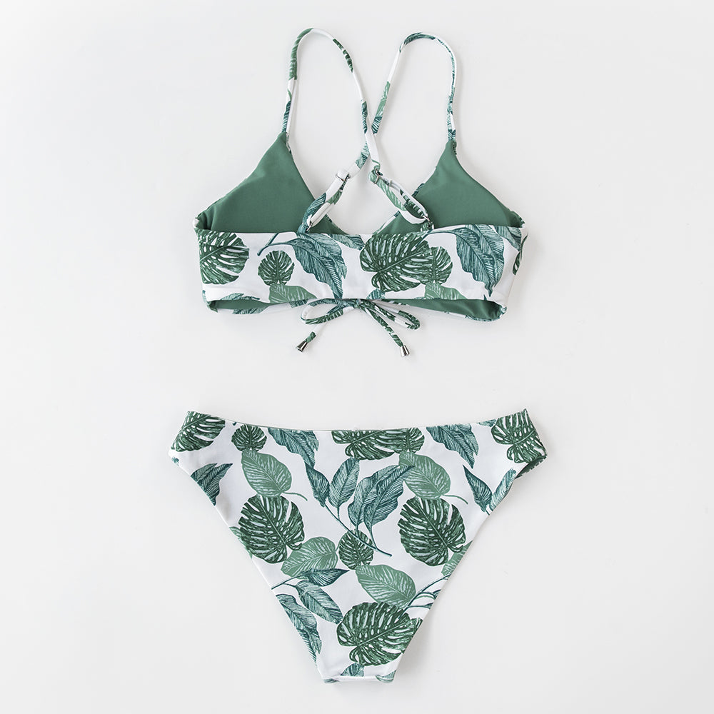 Reversible floral V-neck thong bikini set with two-piece swimsuit design, featuring colorful floral pattern and beach-ready style.
