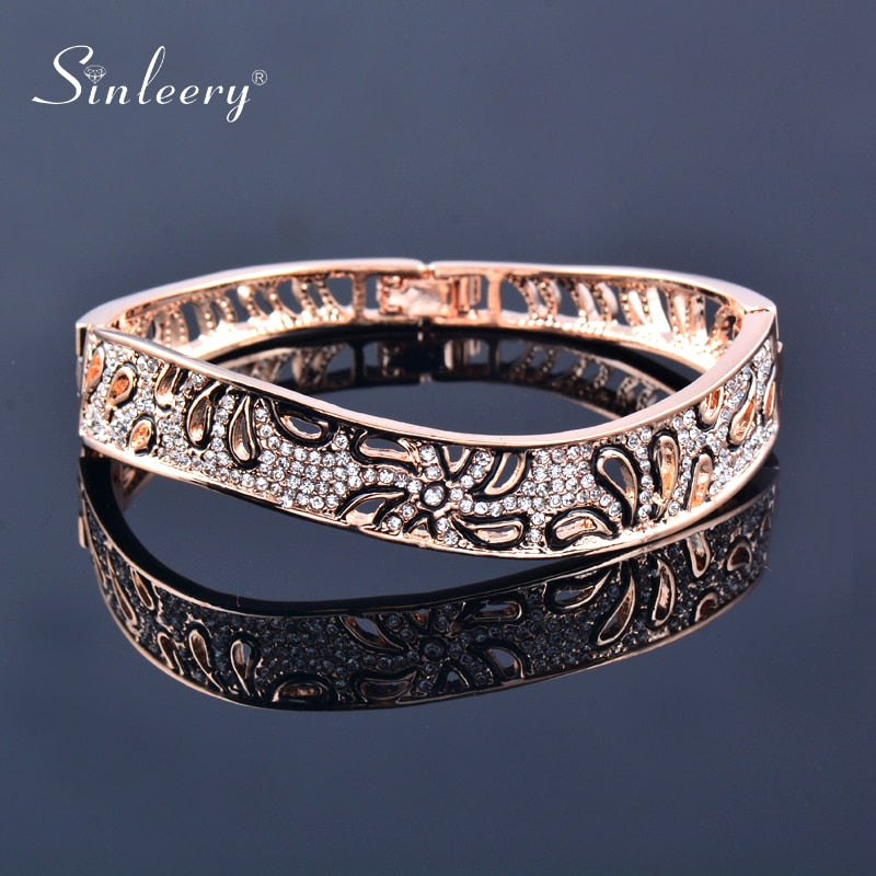 Luxury hollow flower bangles for women, rose gold and silver crystal bracelet, elegant jewelry for best friends or special occasions.