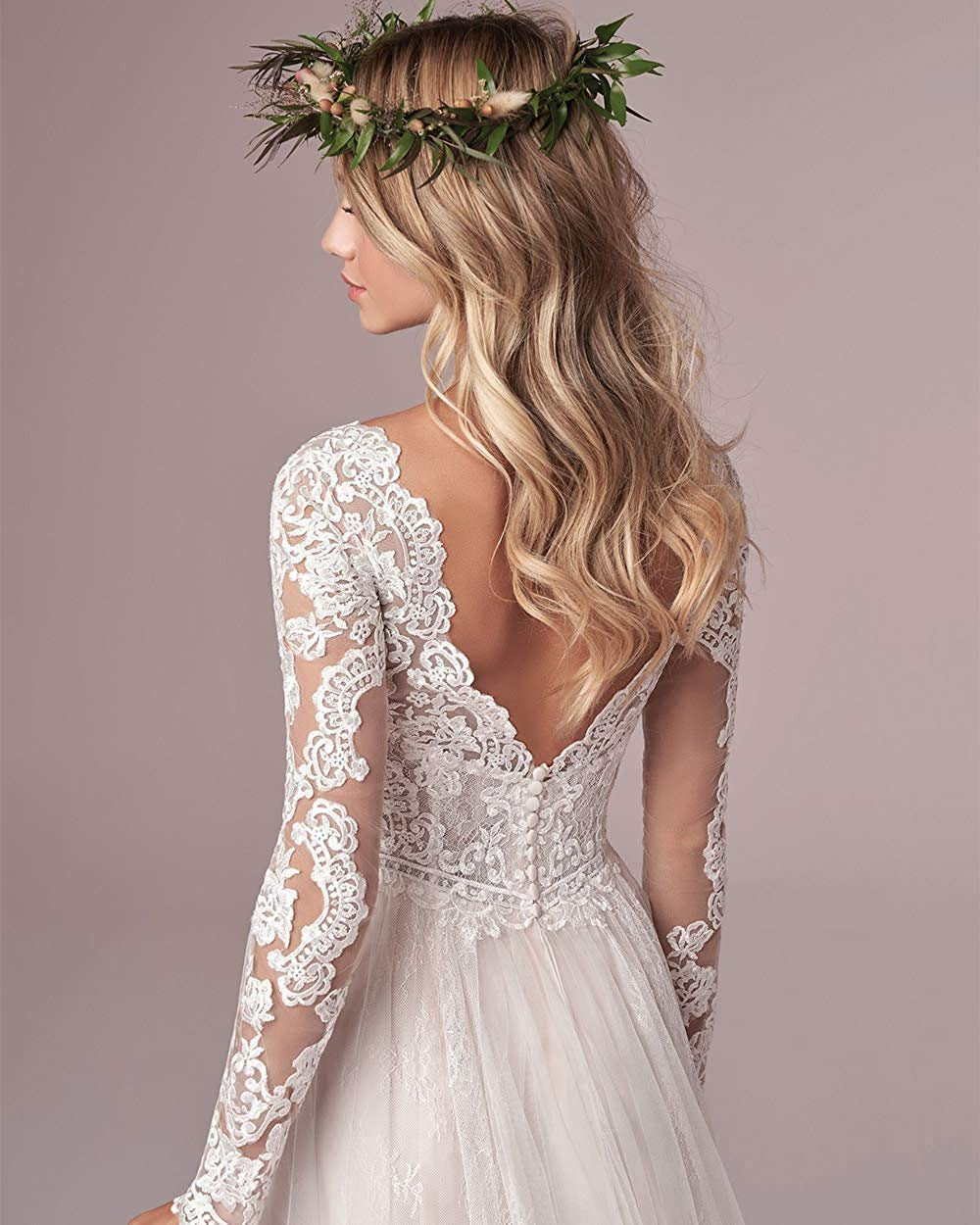 Ivory A-line long sleeve wedding dress with lace details, tulle fabric, and open back design by The Clothing Company Sydney