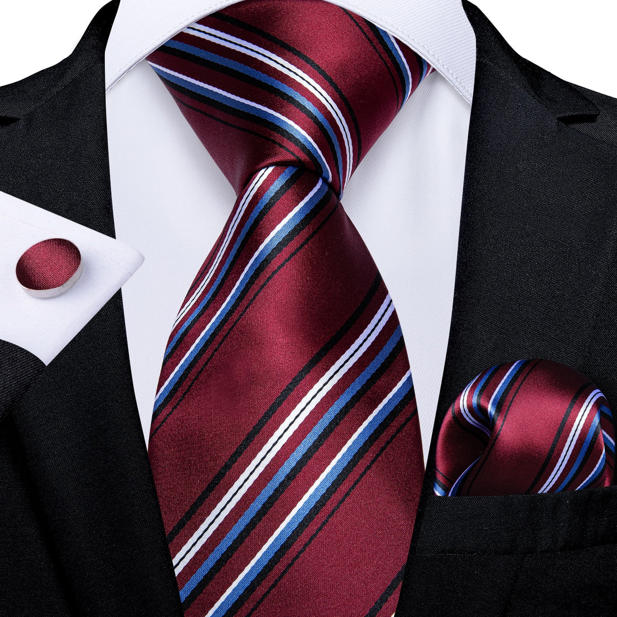 Red designer men's tie with striped and paisley patterns, paired with matching accessories including cufflinks and pocket square.