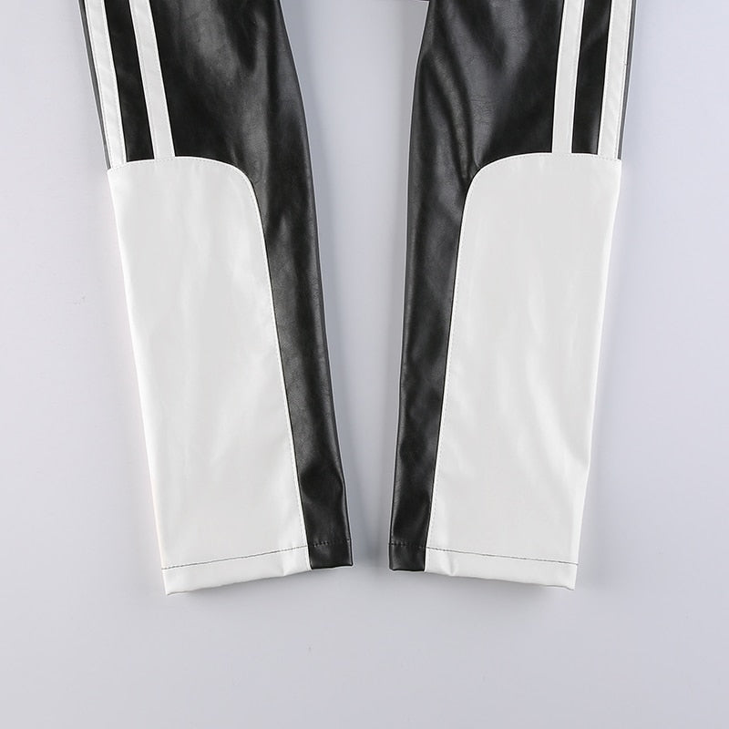 Women’s punk style patchwork cropped PU leather jacket with zippers, contrast colors, suitable for autumn and winter.