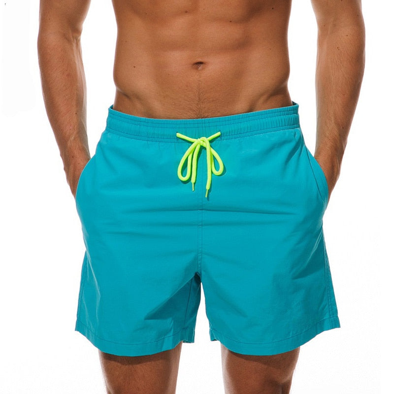 Men's swim shorts from The Clothing Company Sydney featuring beach and surf-style design, suitable for swimming and beach sports.