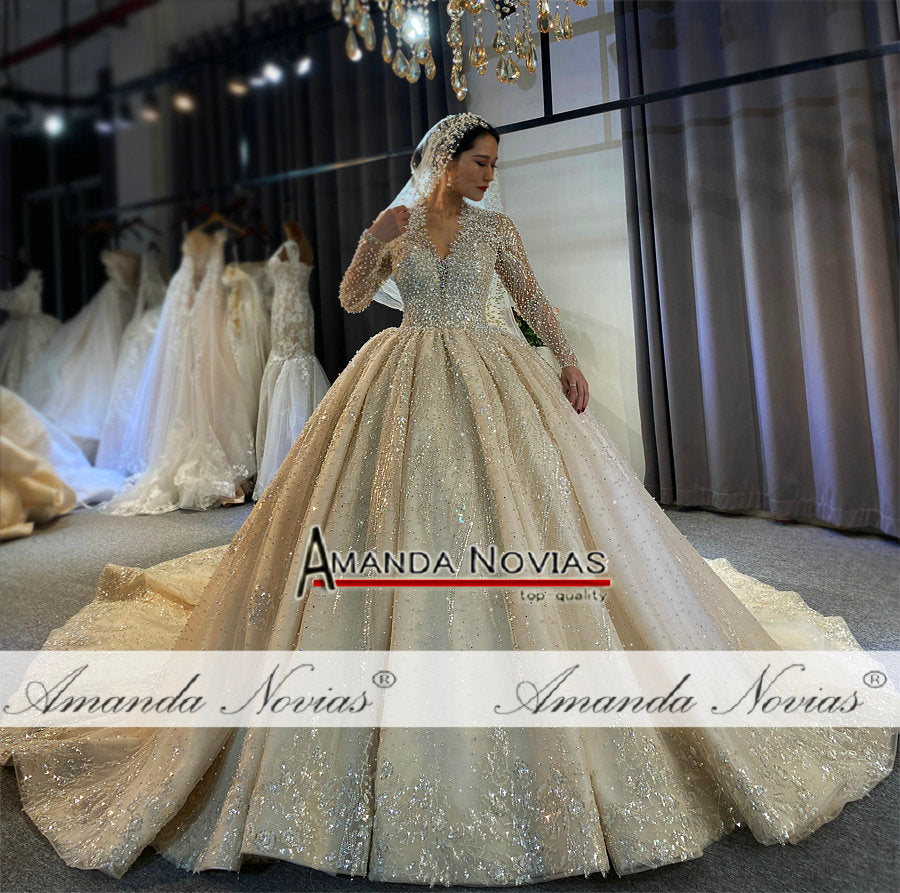 Luxury full pearls wedding dress with long train by The Clothing Company Sydney, elegant bridal gown with intricate pearl detailing