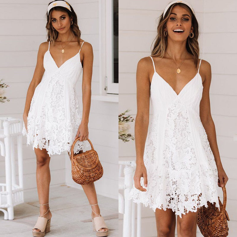White boho V-neck long sleeve lace dress featuring hollow-out detailing, casual and elegant style by The Clothing Company Sydney.
