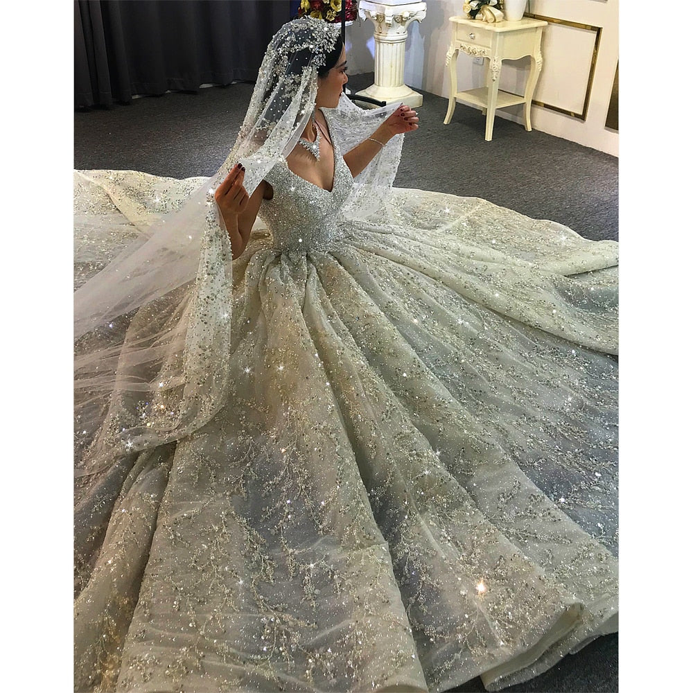 Luxury wedding dress by The Clothing Company Sydney featuring heavy beading, elegant bridal gown with intricate detailing.