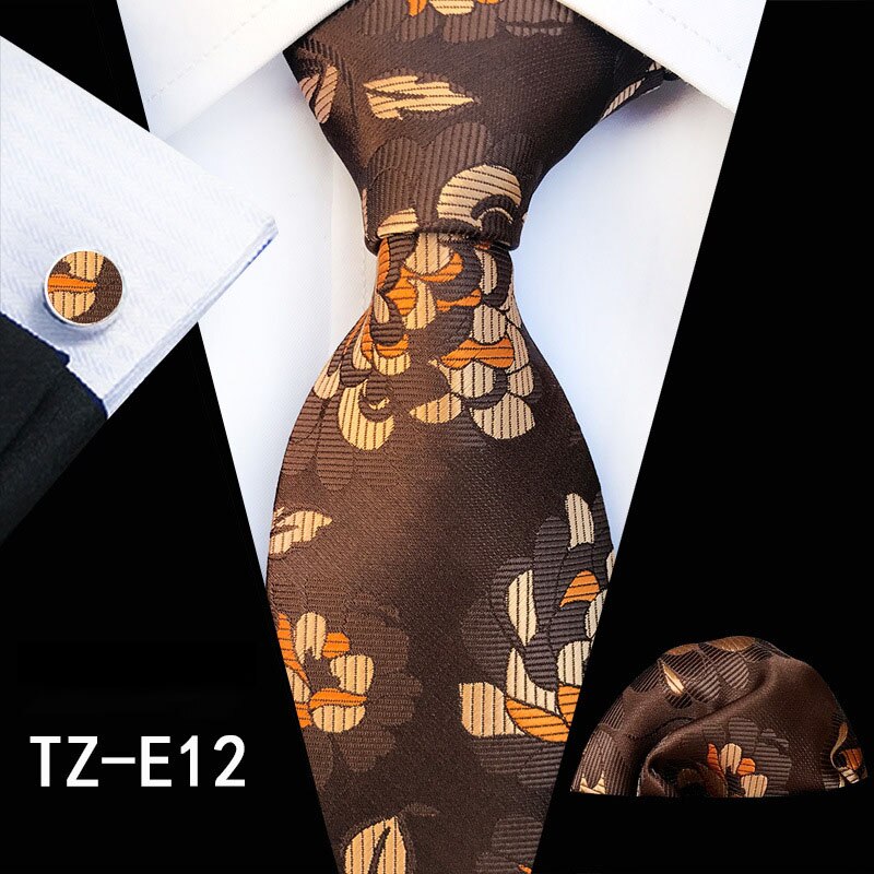 Fashion men's silk tie set with red and green floral design, includes cufflinks, handkerchief, and matching accessories.
