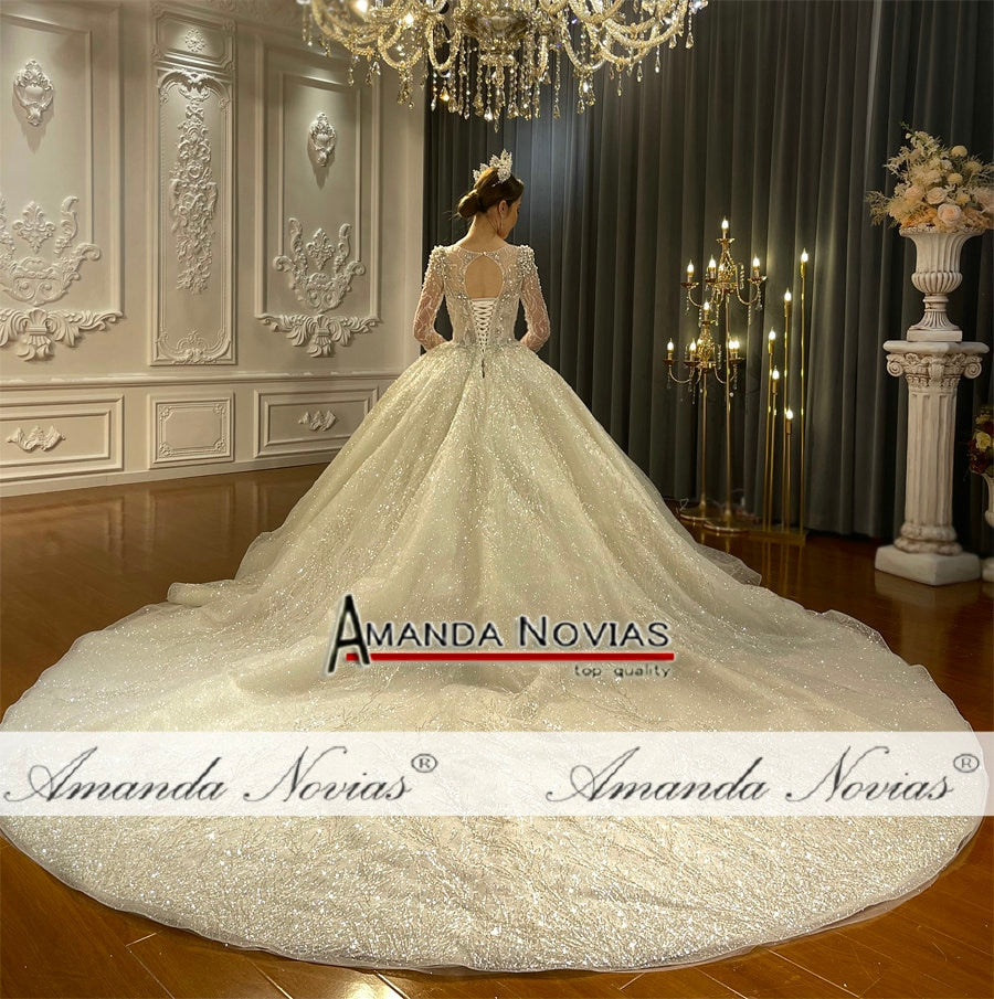 Elegant vintage wedding dress by The Clothing Company Sydney featuring luxurious pearl beading and intricate bridal gown details.