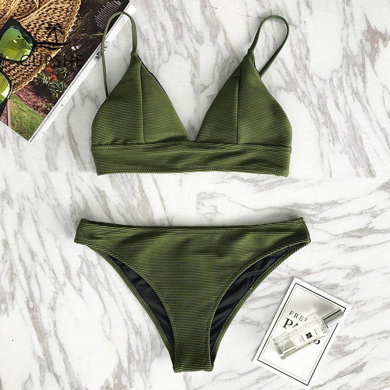 Army green solid bikini set by The Clothing Company Sydney, featuring triangle tops and matching bottoms for beachwear.