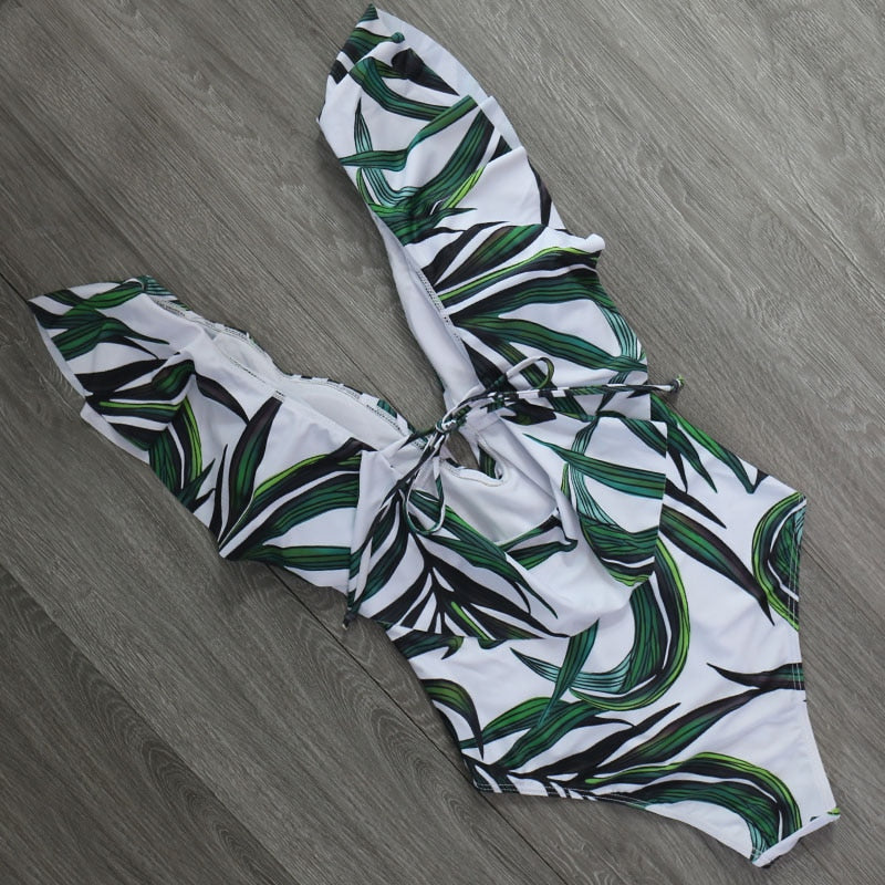 The Clothing Company Sydney one-piece swimsuit featuring ruffle details, push-up design, adjustable shoulder straps, and monokini style.