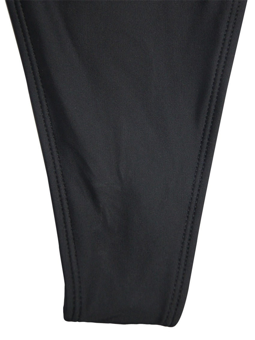 Backless high-leg one-piece swimsuit by The Clothing Company Sydney, featuring thong cut and Brazilian-style monokini design.