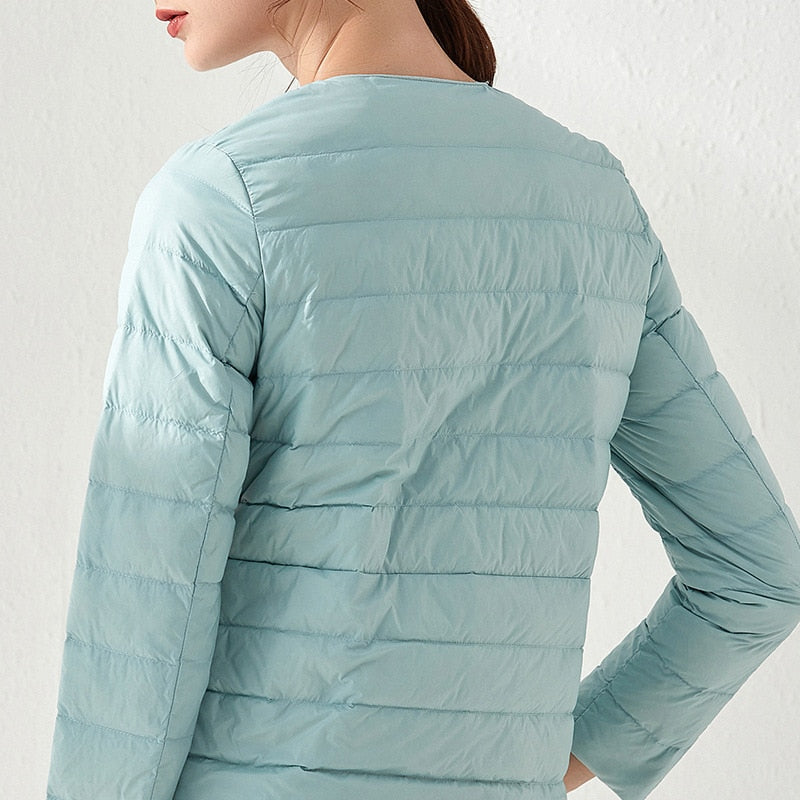 Lightweight women's down jacket from The Clothing Company Sydney with ultra-light duck down, matte fabric, windbreaker style, outdoor coat
