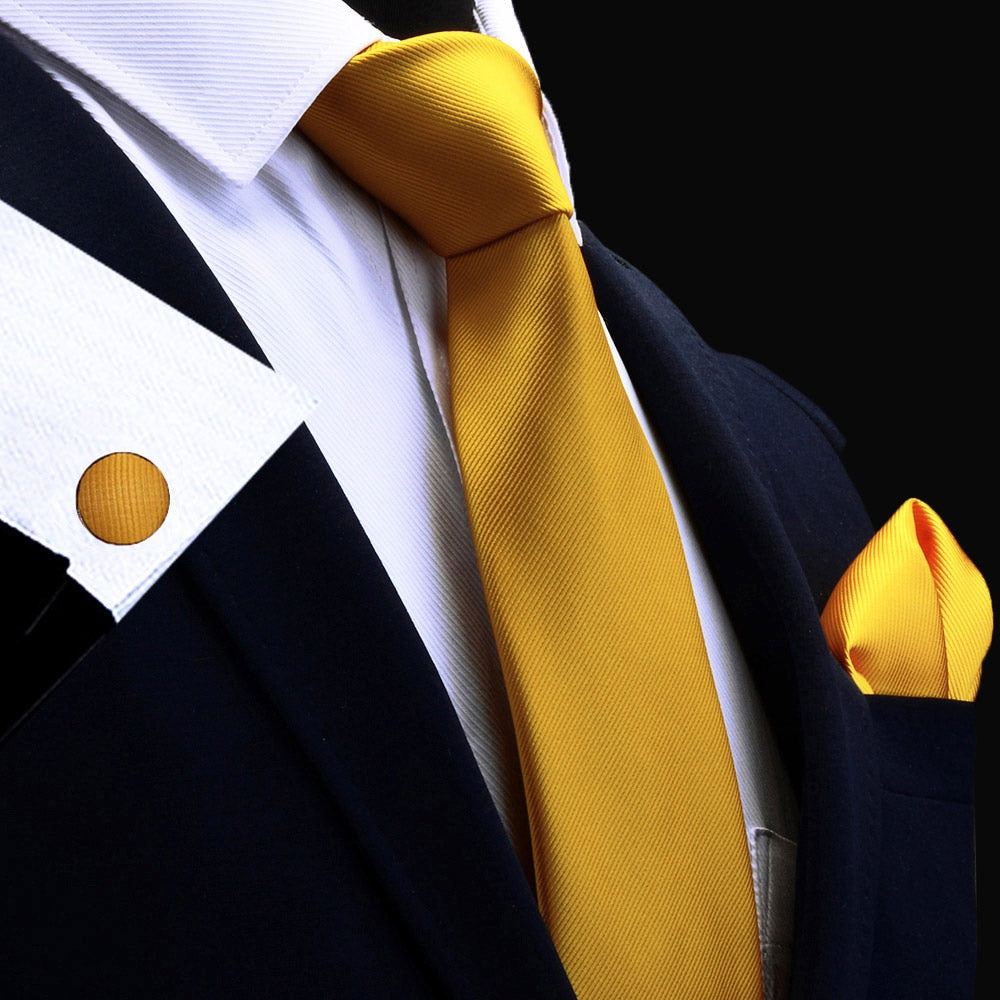 Three men's silk tie set with red, gold, and purple ties, matching handkerchiefs, and cufflinks, ideal for wedding accessories.