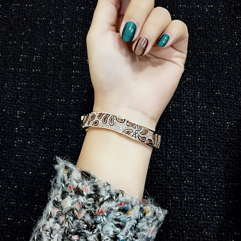 Rose gold and silver hollow flower bracelet with crystal accents, stylish jewelry for women and best friends from The Clothing Company Sydney