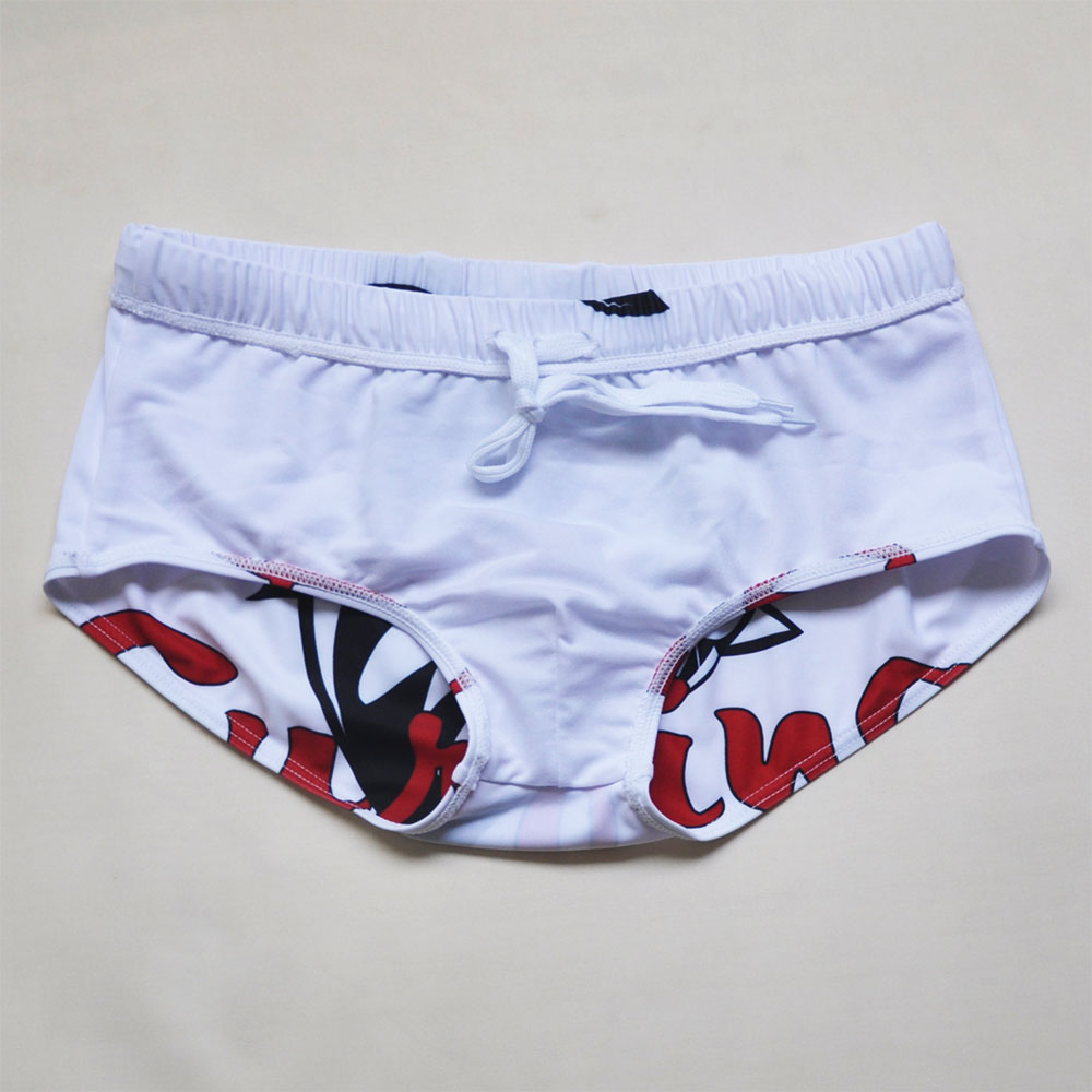 Men's shark pattern swim shorts by The Clothing Company Sydney, quick-dry surfing trunks for beach and swimming activities.