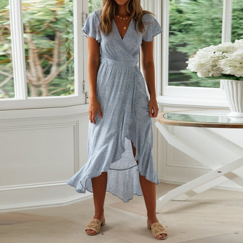 Long boho floral print summer maxi dress by The Clothing Company Sydney featuring a V-neck, ruffle details, and high slit.