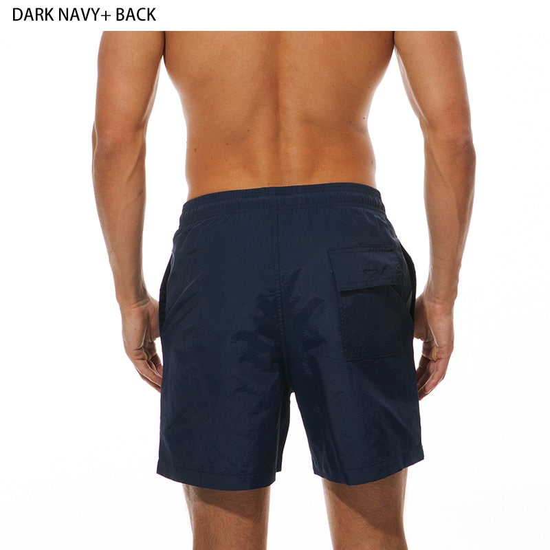 Men's swim shorts by The Clothing Company Sydney, beach board shorts with quick-dry fabric and vibrant surf-inspired design.