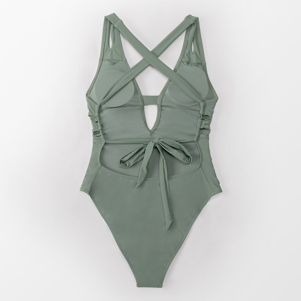 Solid dark blue one-piece swimsuit by The Clothing Company Sydney featuring deep V-neck, backless design, and X-back style.